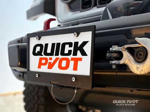 Close-up of the installed Quick Pivot Plate System with the Front Plate Swing Arm in the normal, upright (locked) position. 